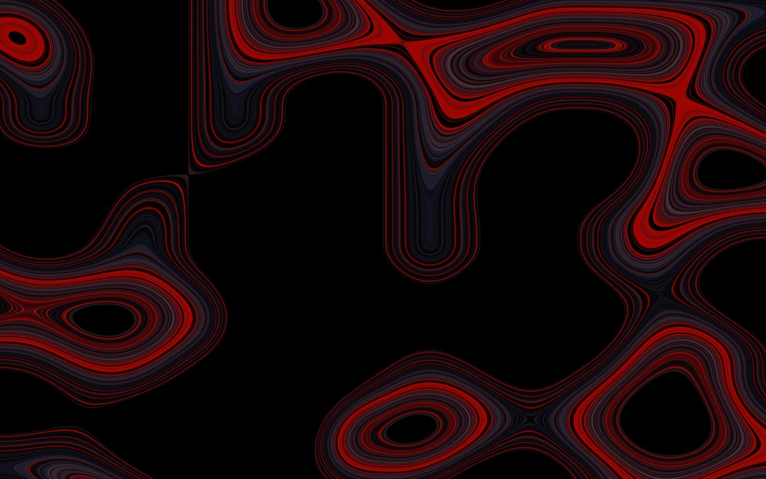 a black background with red and black swirls