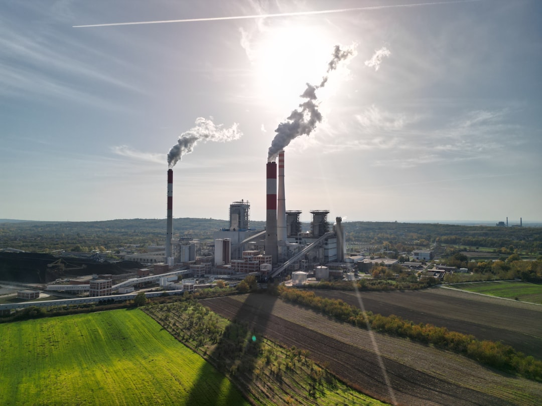 A factory with smoke coming out of it's stacks